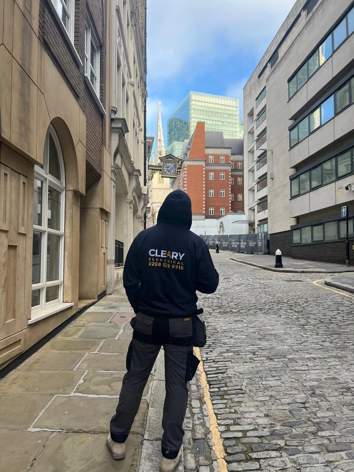 Cleary Electrical team member in branded hoodie in the City of London
